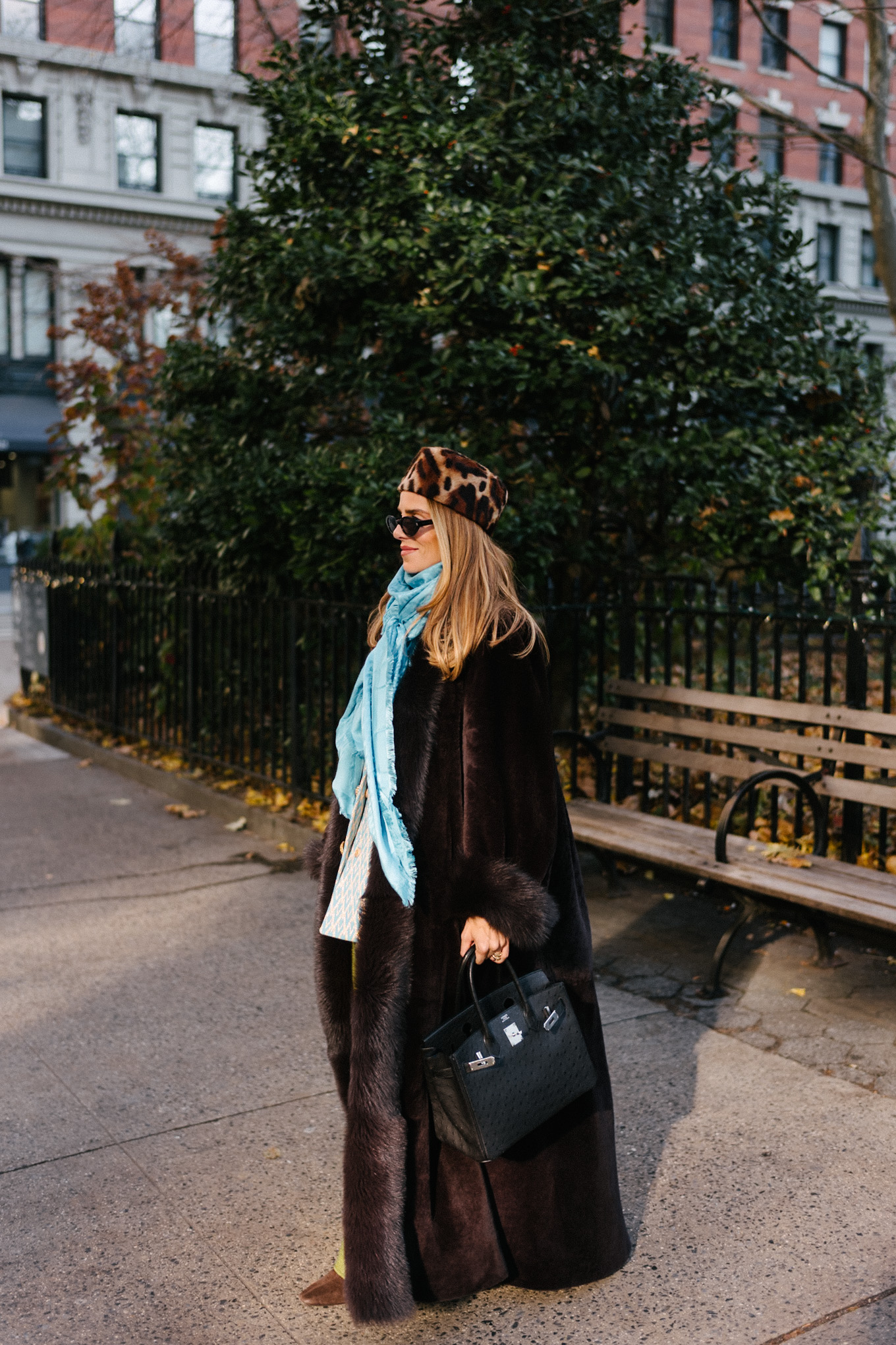 brown shearling coat leopard pill box hat green satin pants turquoise silk scarf