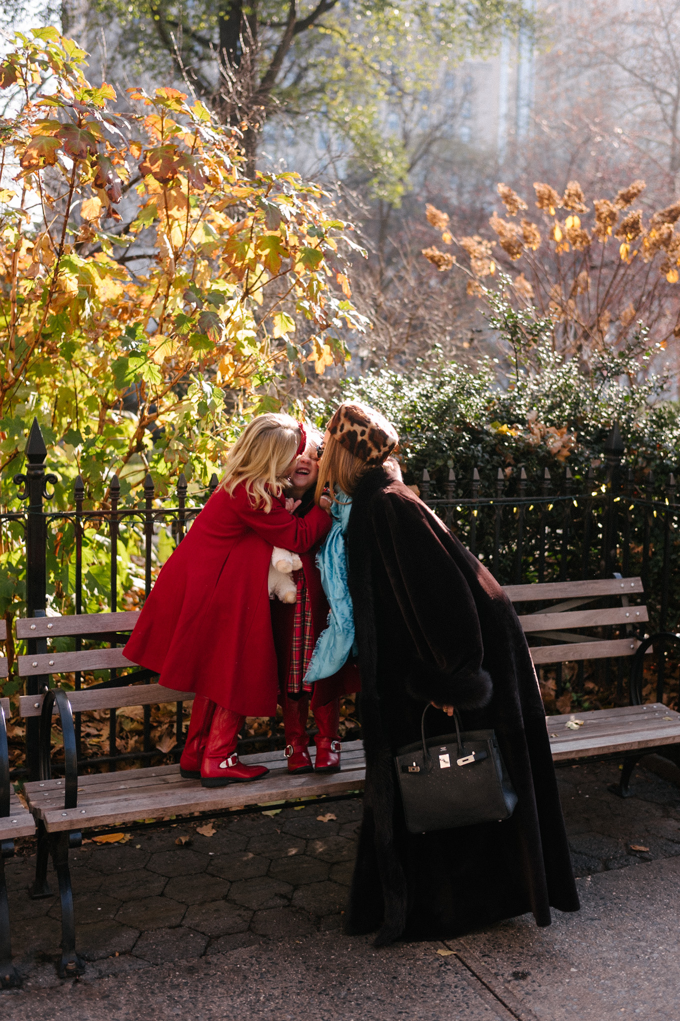brown shearling coat leopard pill box hat green satin pants turquoise silk scarf