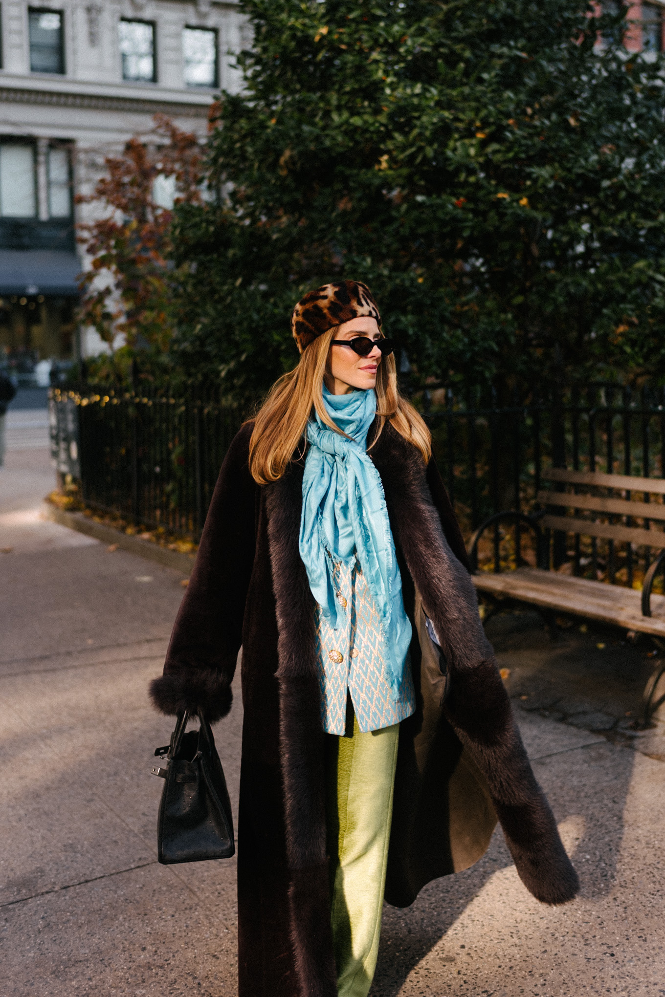 brown shearling coat leopard pill box hat green satin pants turquoise silk scarf