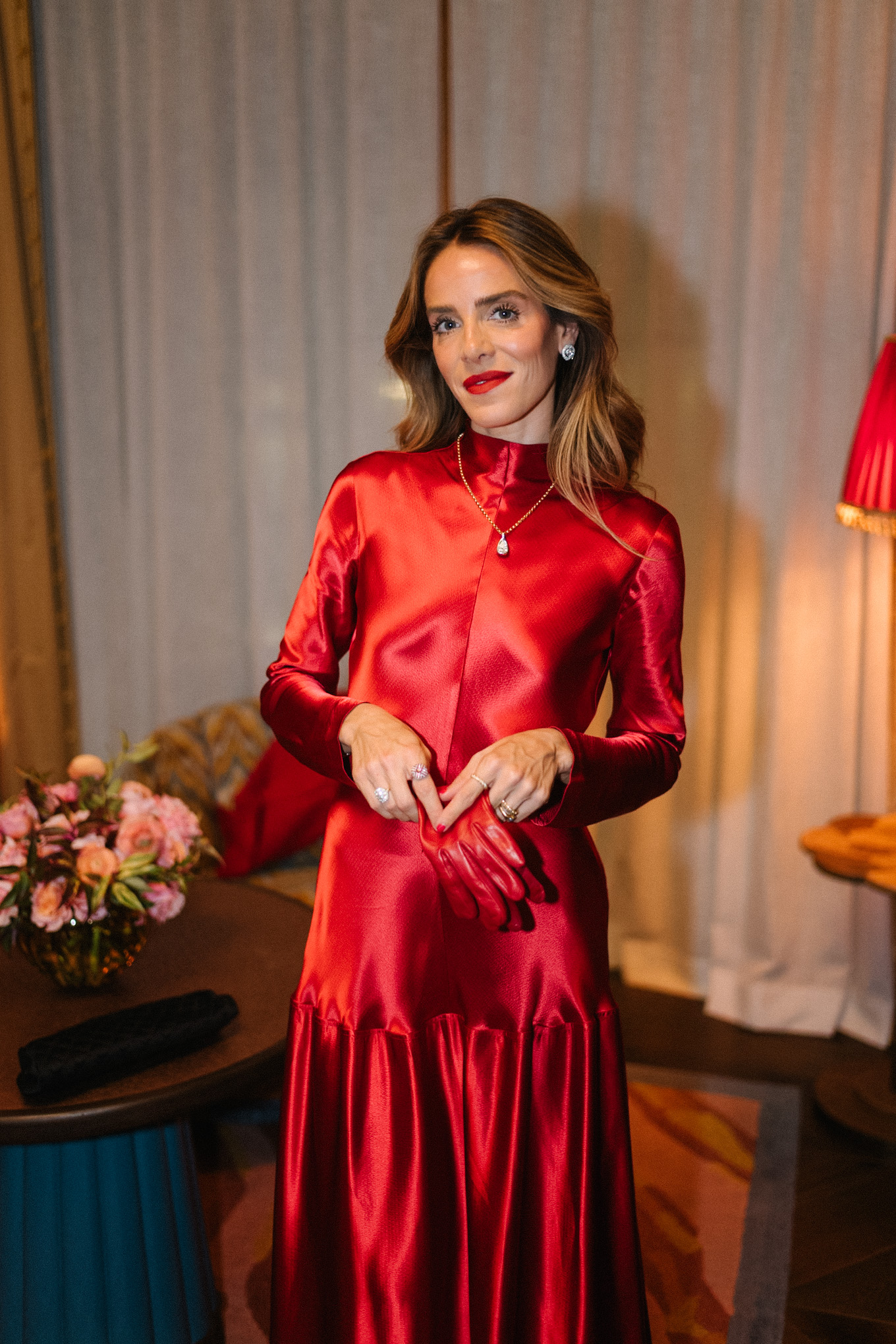 red satin long sleeved maxi dress red leather gloves