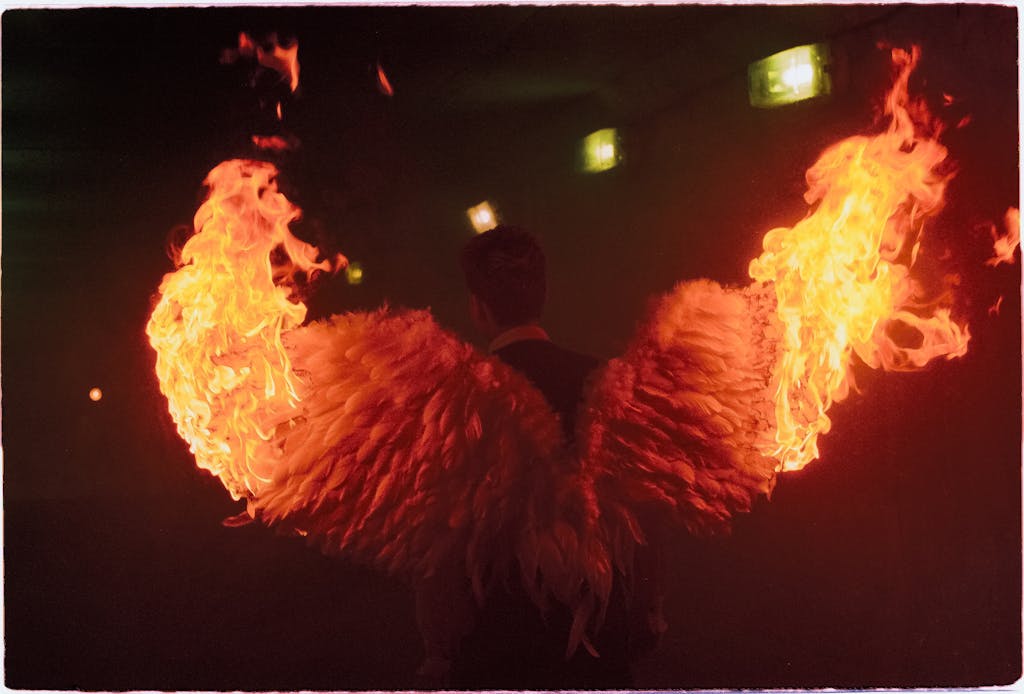 A dramatic image of angelic wings on fire, creating a striking visual in a dark setting.
what I’m carrying into the new year