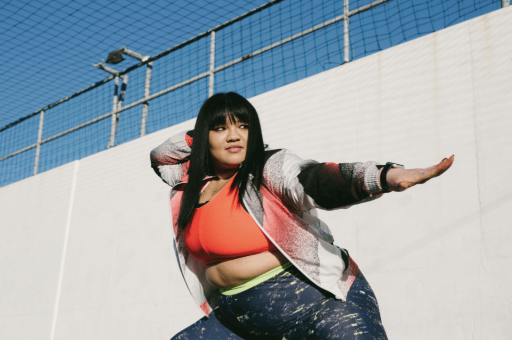 plus size woman wearing plus size sport bra outside

plus size sports bra support