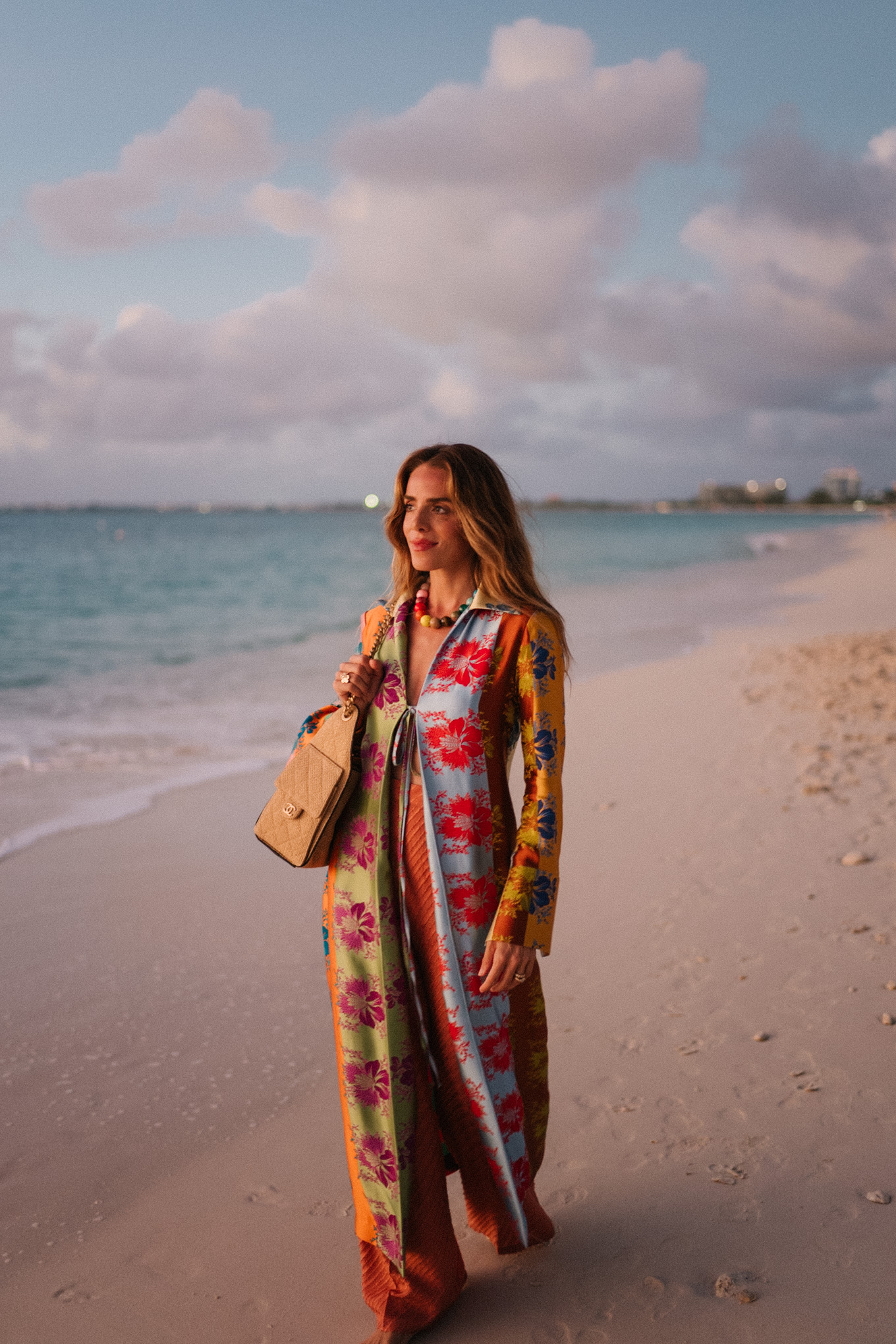 rainbow floral silk jacket silk wide leg pants rainbow beaded necklace rattan bag