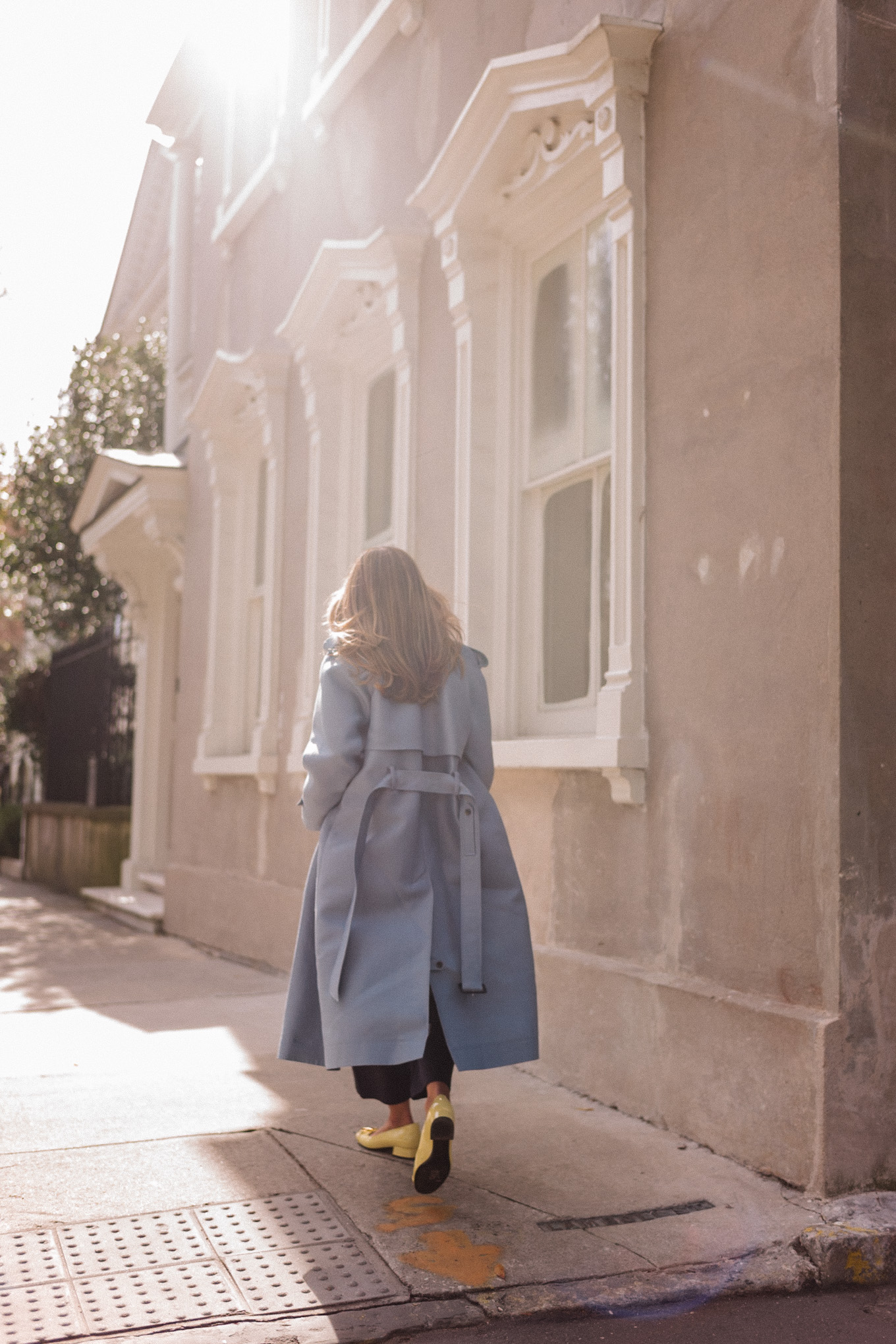 blue wool coat red sweater green blouse yellow flats flower brooch