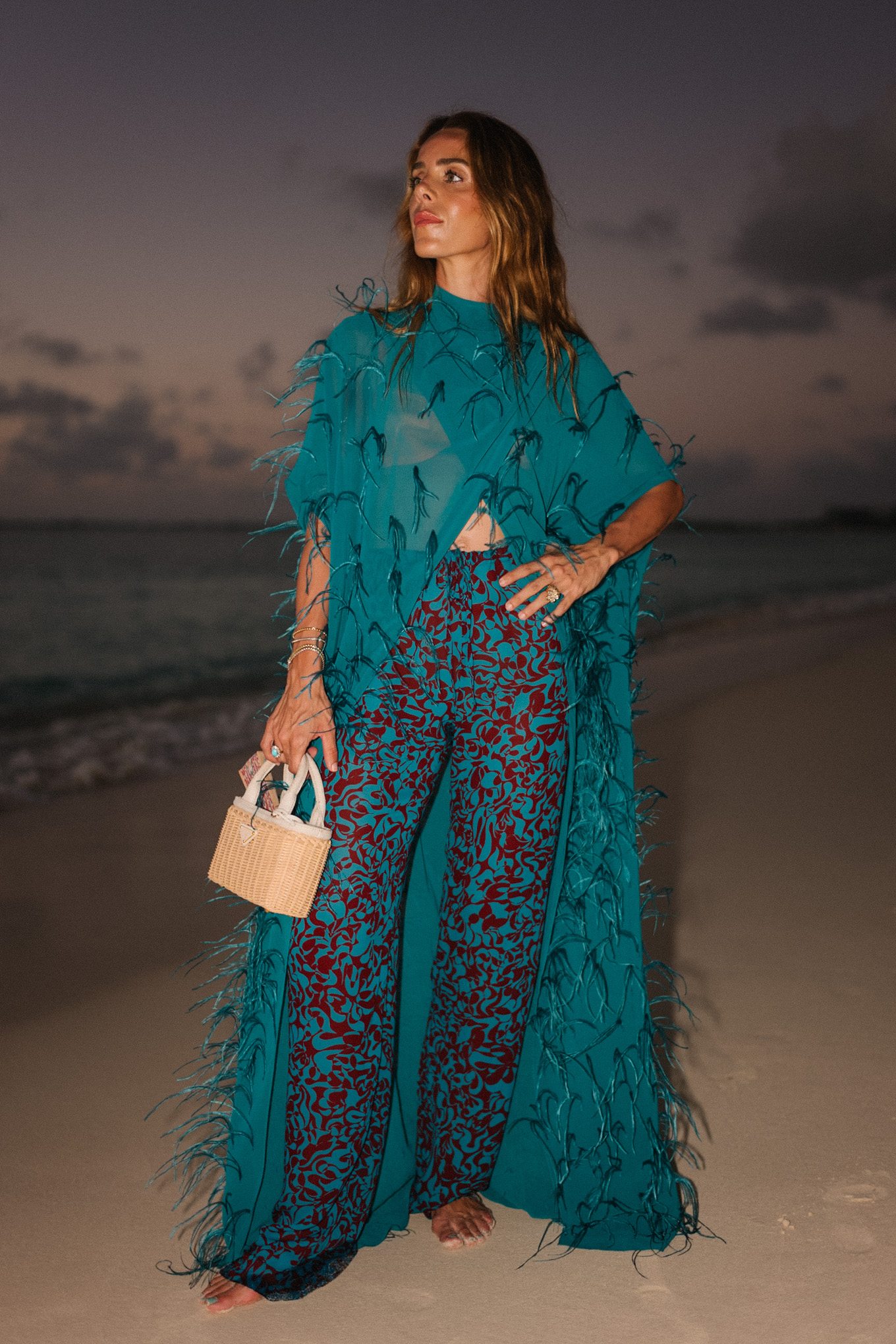 turquoise feathered maxi top turquoise printed wide leg pants wicker handbag