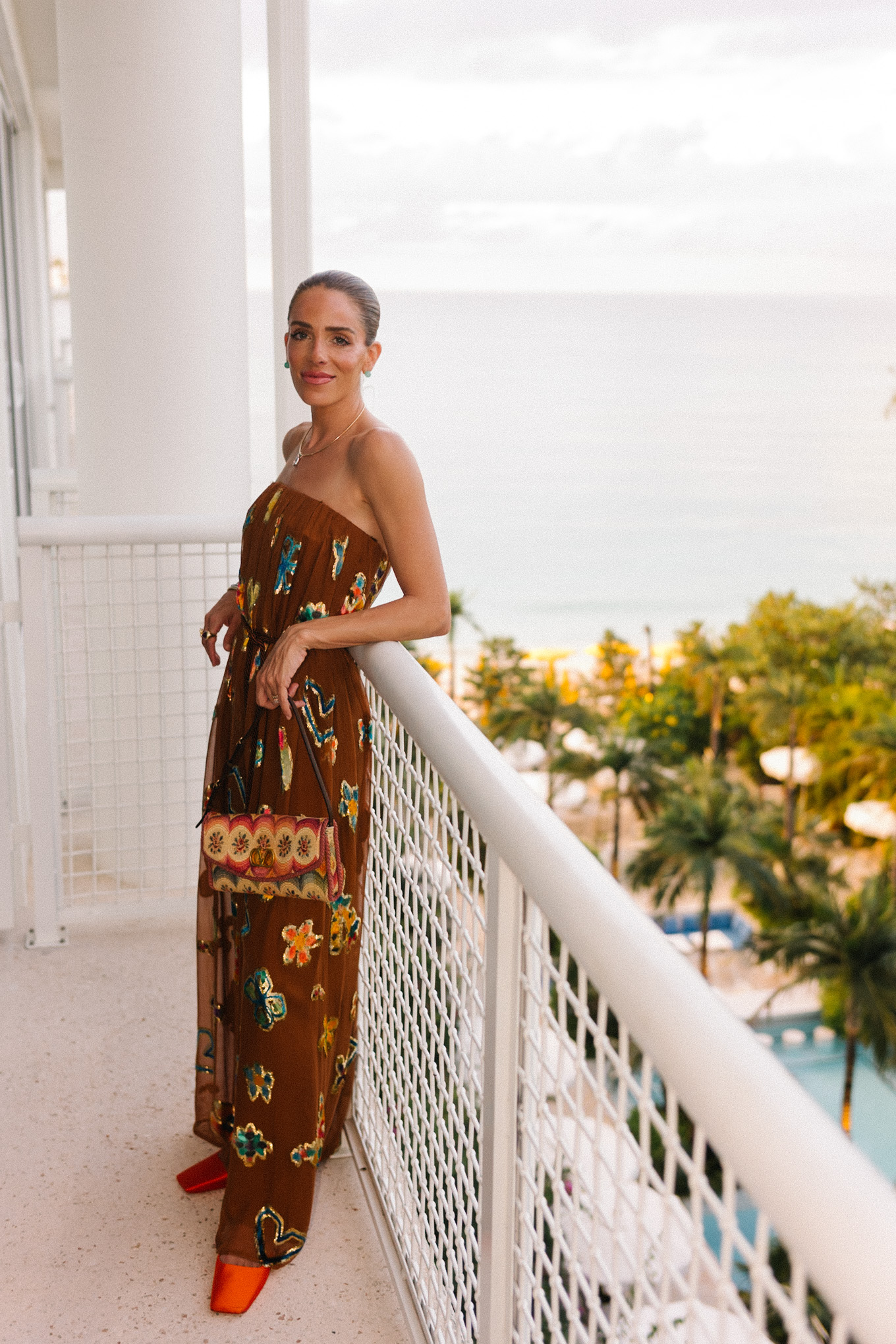 brown strapless maxi dress woven rainbow handbag