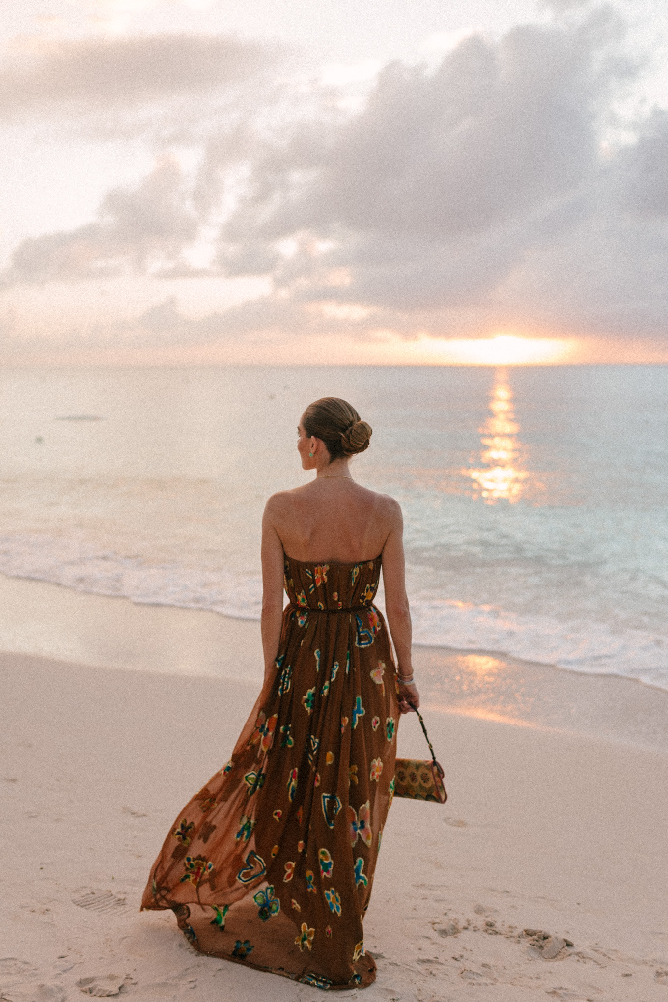 brown strapless maxi dress woven rainbow handbag