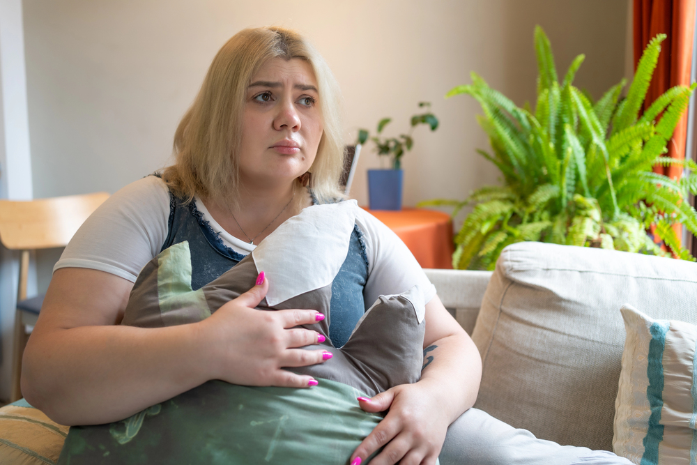 sad plus size woman